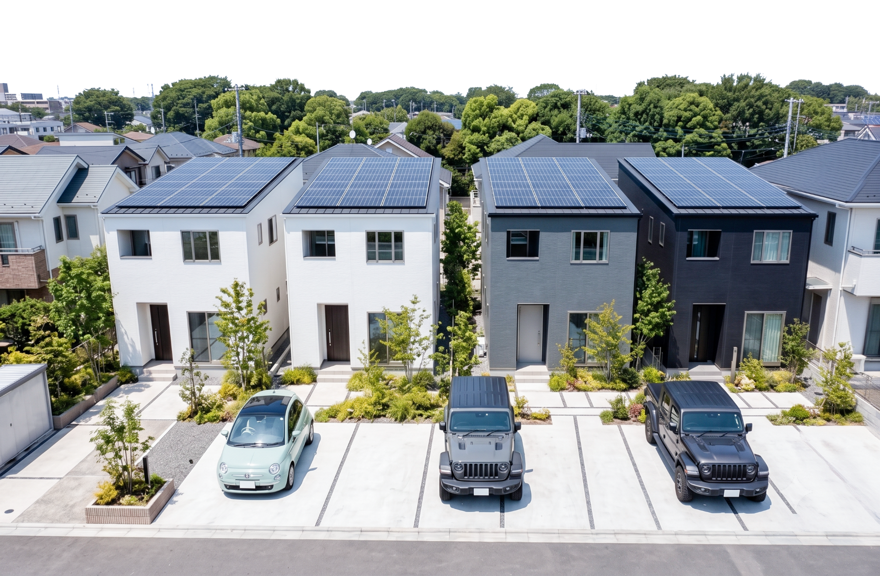 太陽光パネルを搭載した白とグレーのGREEN BONDの住宅街